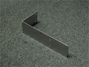 Stainless Steel L Bracket for reinforcing swing door hinges mounted in the jamb.