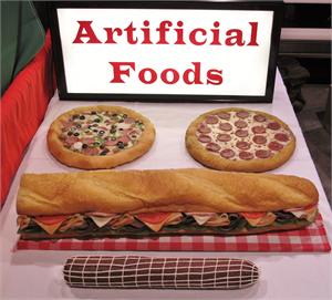 Replica foods for sale with fake pizza for display and fake foods for display in restaurants and grocery stores.