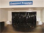 Black plastic strip curtains and black PVC rolls. Black plastic strip curtains for airport luggage conveyor belts.