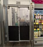 The Clear Swinging Cool Curtain Gorilla Door for grocery store coolers and freezer door openings.